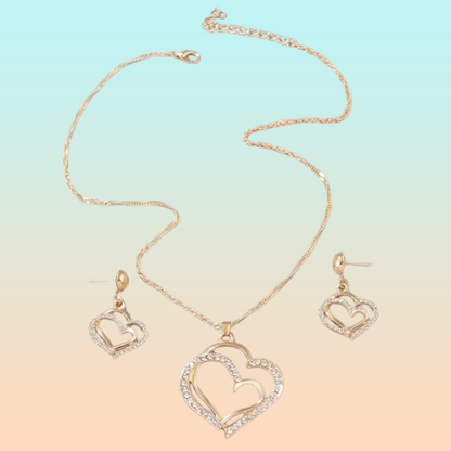 CONJUNTO CADENA Y ARETES DOBLE CORAZÓN DORADO INCRUSTACIONES LAVANDA