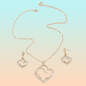 CONJUNTO CADENA Y ARETES DOBLE CORAZÓN DORADO INCRUSTACIONES LAVANDA