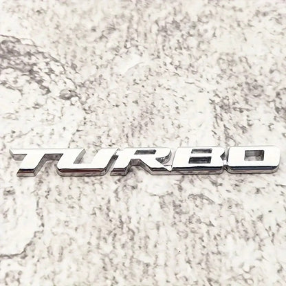 EMBLEMA TURBO METAL 3D ADHESIVO VEHÍCULO INSIGNIA CROMADO