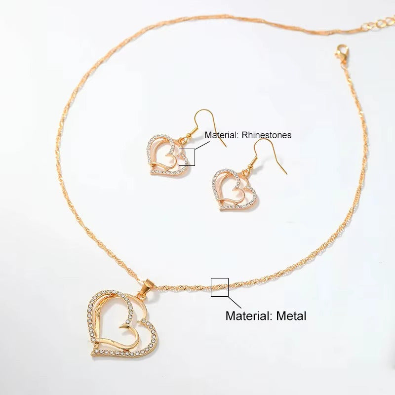 CONJUNTO CADENA Y ARETES DOBLE CORAZÓN DORADO INCRUSTACIONES LAVANDA